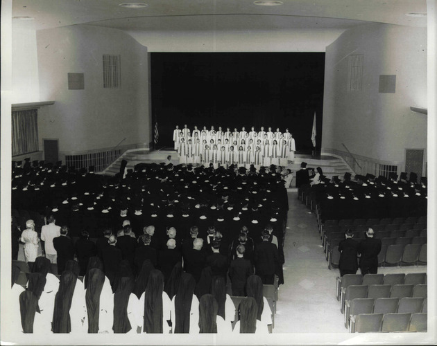 Students performing on stage for Founders' Day, 1956